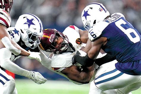 Bland, Prescott help Cowboys to 13th straight home win with 45-10 victory over Commanders